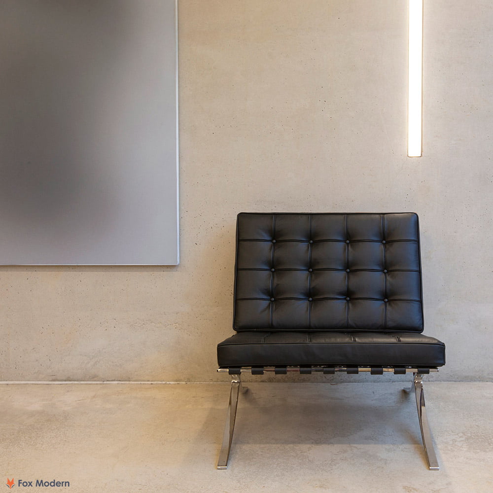 Front view of black Barcelona Pavilion Chair shown in a living space