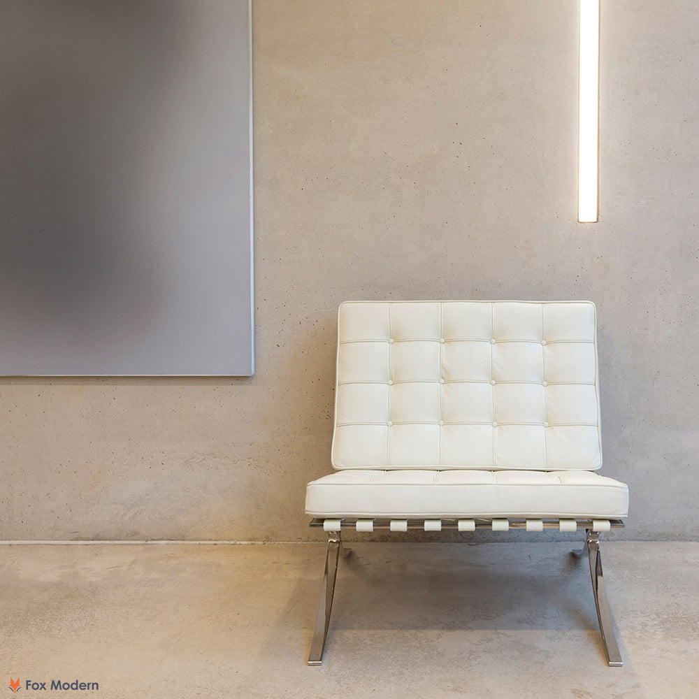 Front view of white Barcelona Pavilion Chair shown in a living space