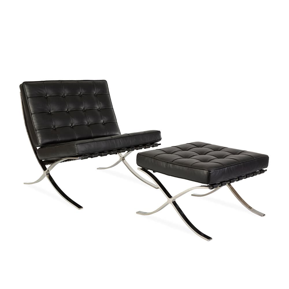 Angled front view of the black leather Barcelona Pavilion Chair and Ottoman on a white background