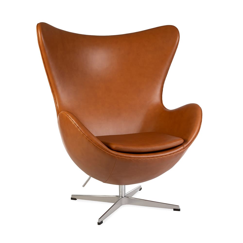 Front angled view of tan leather Jacobsen Egg Chair on a white background