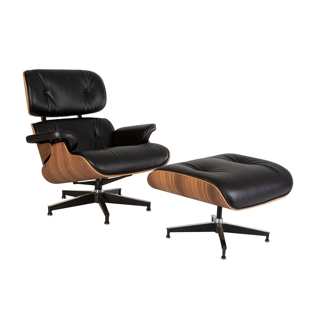 Front angled view of the black and walnut Eames Lounge Chair & Ottoman on a white background