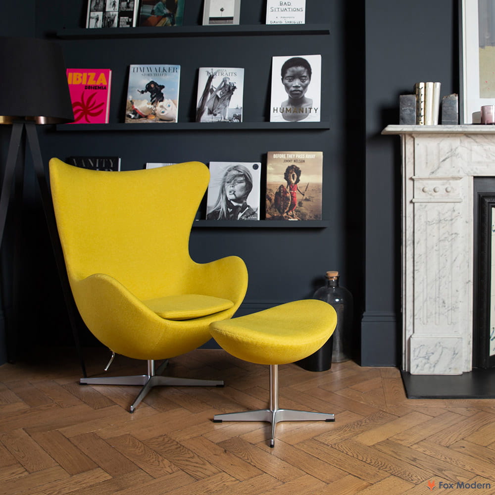 Front angled view of yellow fabric Jacobsen Egg Chair & Ottoman shown in a living space