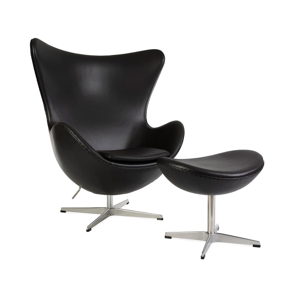 Angled front view of the black leather Jacobsen Egg Chair & Ottoman Set on a white background