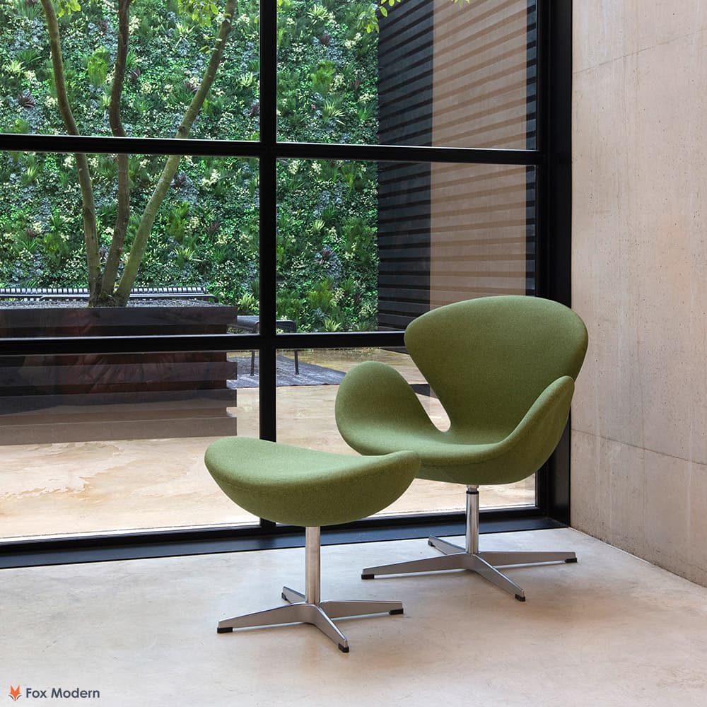 Angled view of green fabric Jacobsen Swan Chair & Ottoman shown in a living space